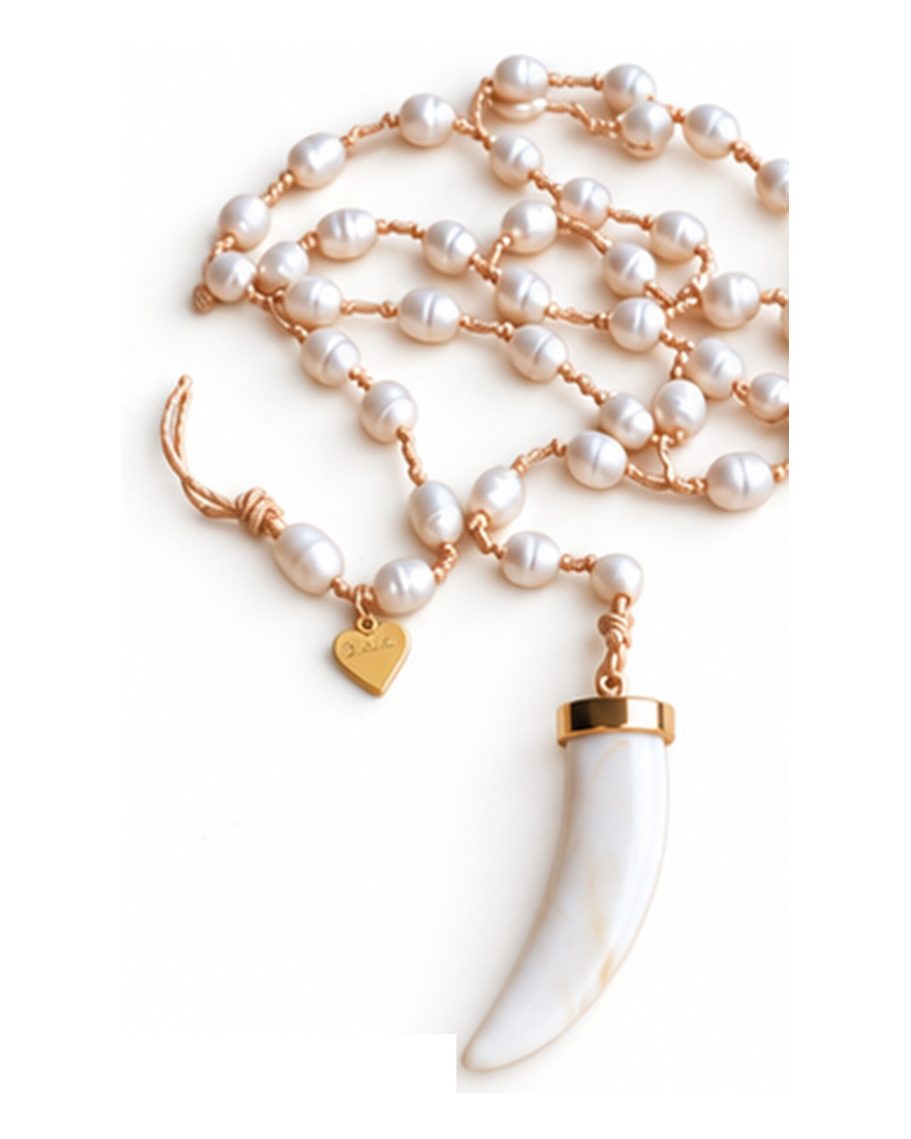 Mother of Pearl Shark Tooth Pendant with Ivory Fresh Water Pearls necklace — real close-up photograph